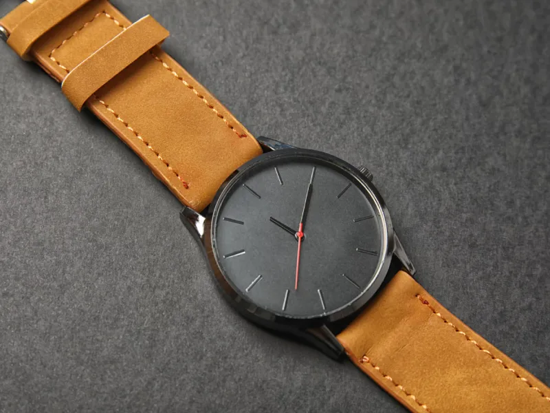 Elegant Watch with Tan Leather Strap on Gray