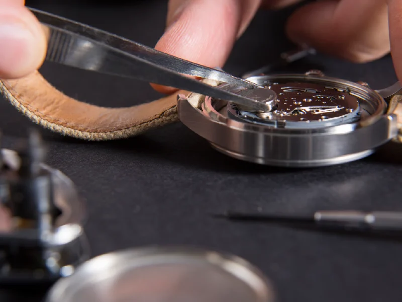 Watch Repair Close Up of Hands and Watch
